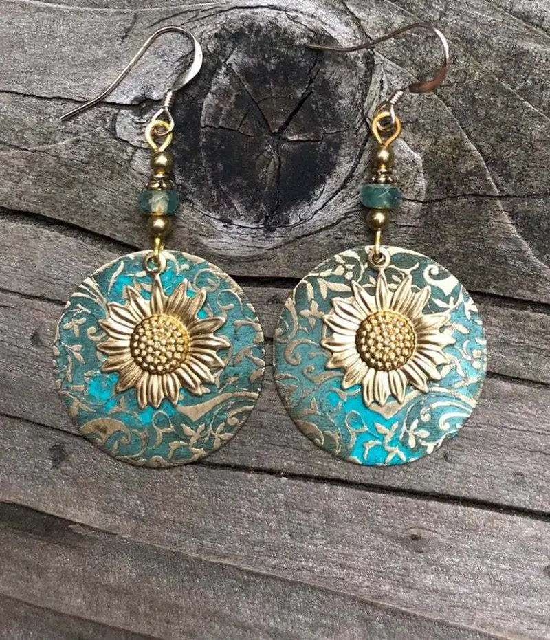 GZ Ice presents elevating your style with our stunning Color Separation Sunflower Earrings, featuring a bohemian-inspired design and intricate detailing that exude timeless elegance and retro charm. Perfect for any occasion.