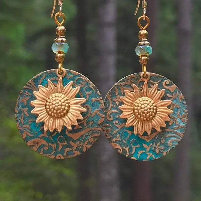 GZ Ice presents elevating your style with our stunning Color Separation Sunflower Earrings, featuring a bohemian-inspired design and intricate detailing that exude timeless elegance and retro charm. Perfect for any occasion.