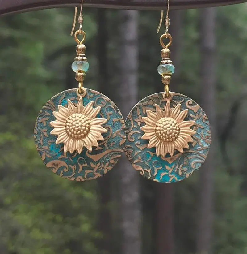 GZ Ice presents elevating your style with our stunning Color Separation Sunflower Earrings, featuring a bohemian-inspired design and intricate detailing that exude timeless elegance and retro charm. Perfect for any occasion.
