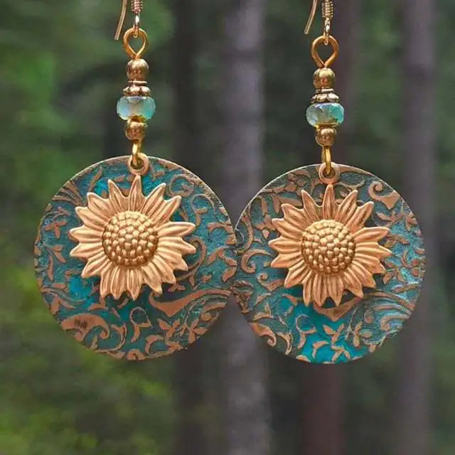 GZ Ice presents elevating your style with our stunning Color Separation Sunflower Earrings, featuring a bohemian-inspired design and intricate detailing that exude timeless elegance and retro charm. Perfect for any occasion.