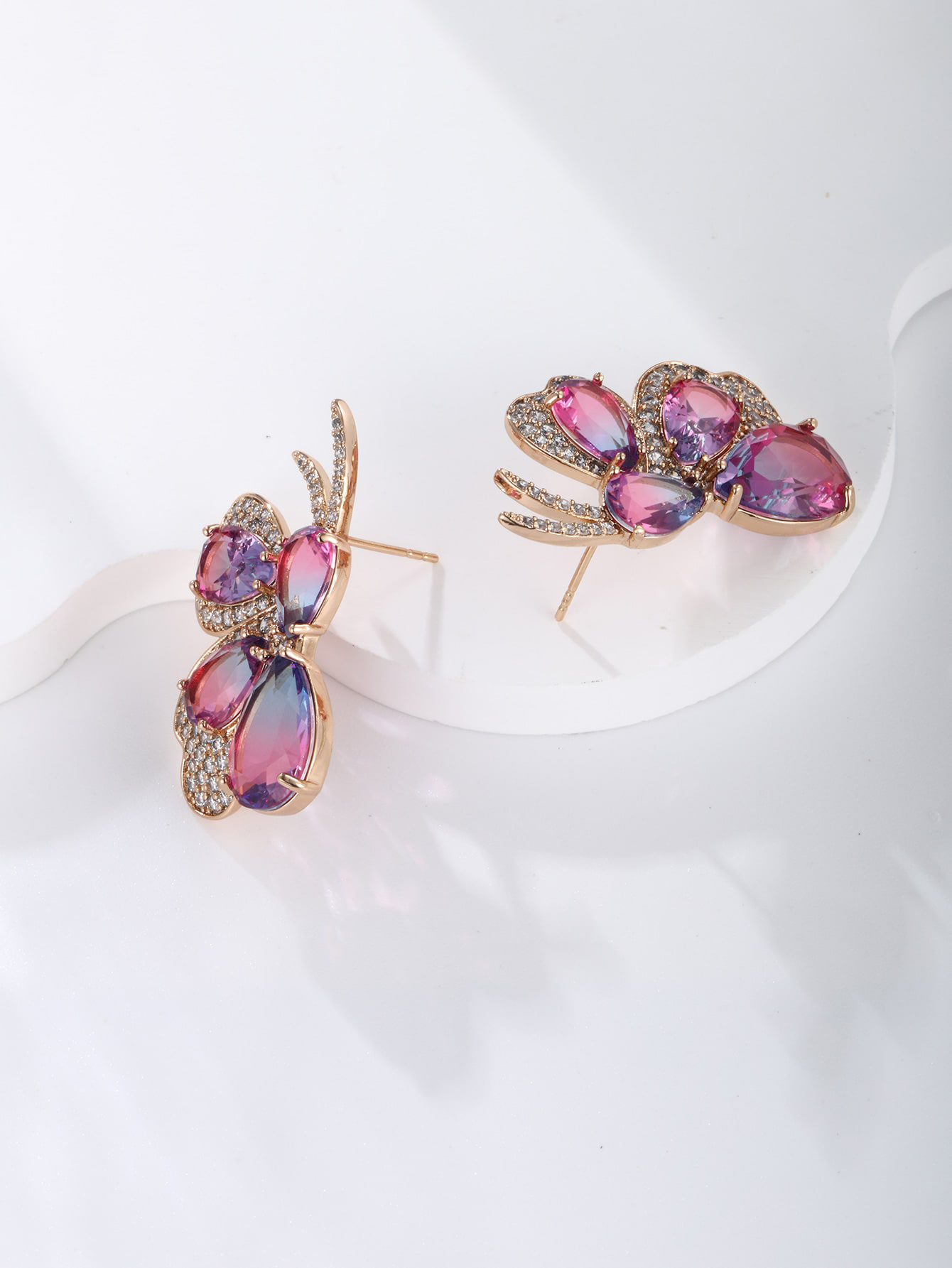 GZ Ice presents A pair of light luxuriously elegant imitation Austrian crystal butterfly earrings.