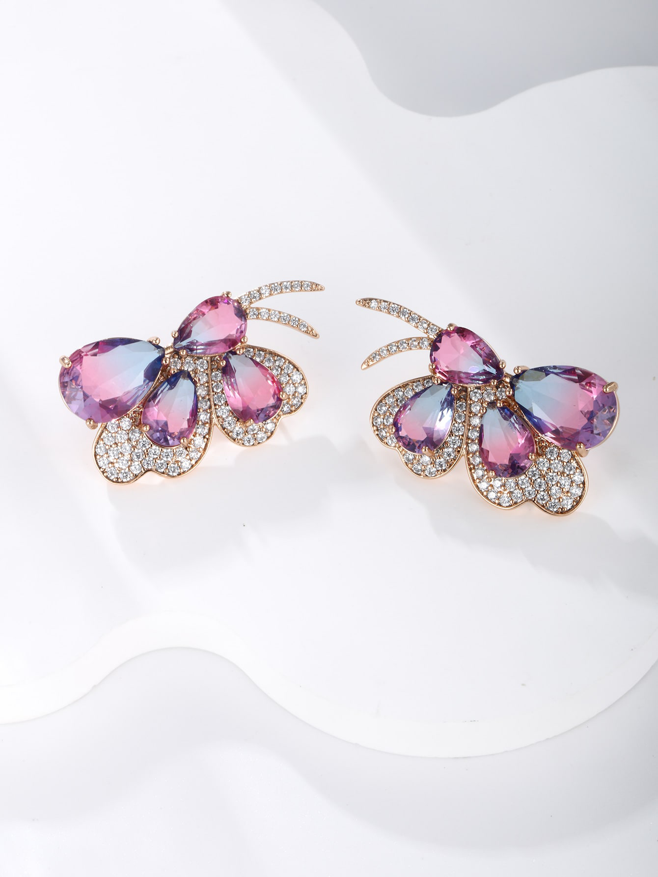 GZ Ice presents A pair of light luxuriously elegant imitation Austrian crystal butterfly earrings.