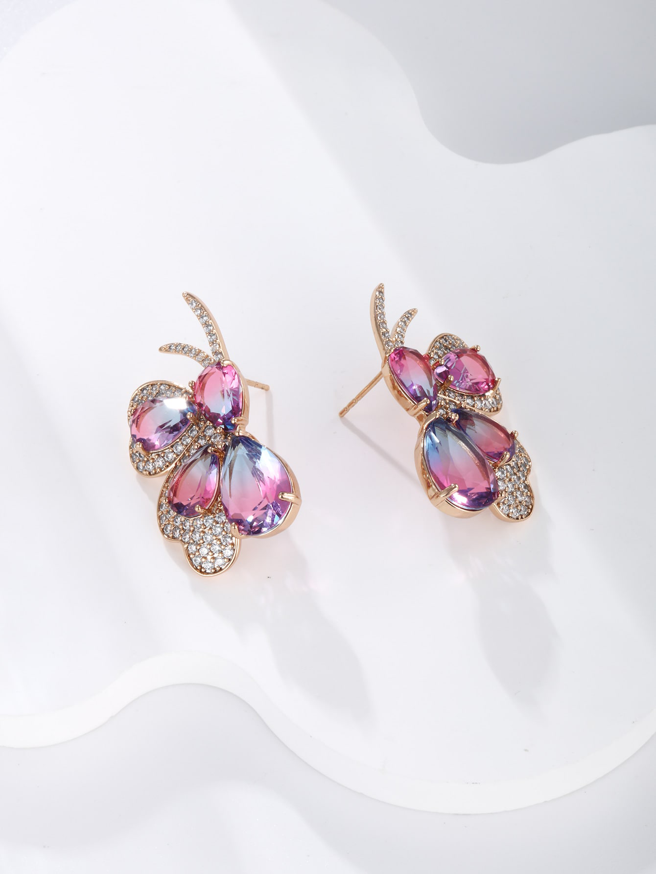 GZ Ice presents A pair of light luxuriously elegant imitation Austrian crystal butterfly earrings.