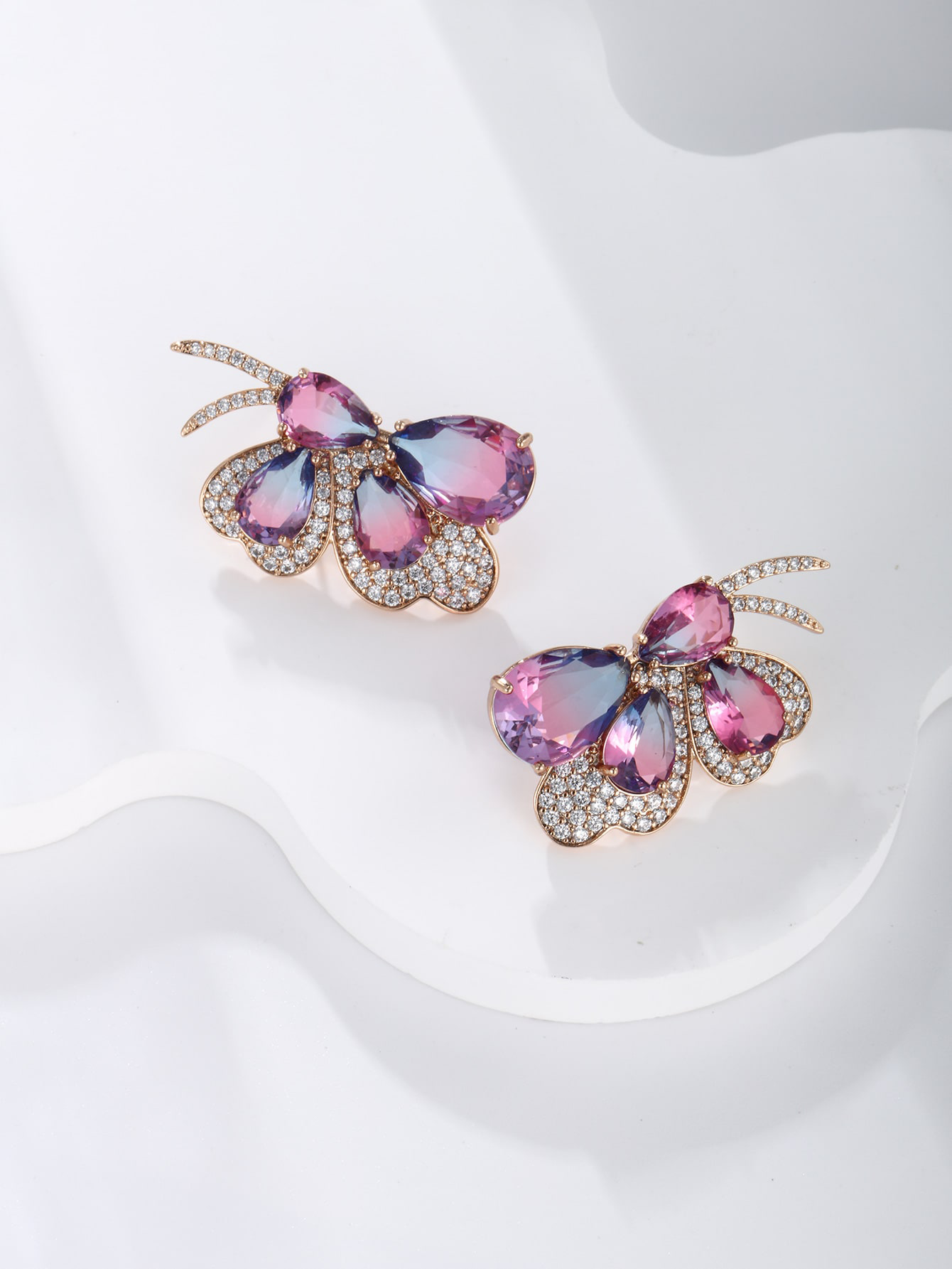 GZ Ice presents A pair of light luxuriously elegant imitation Austrian crystal butterfly earrings.