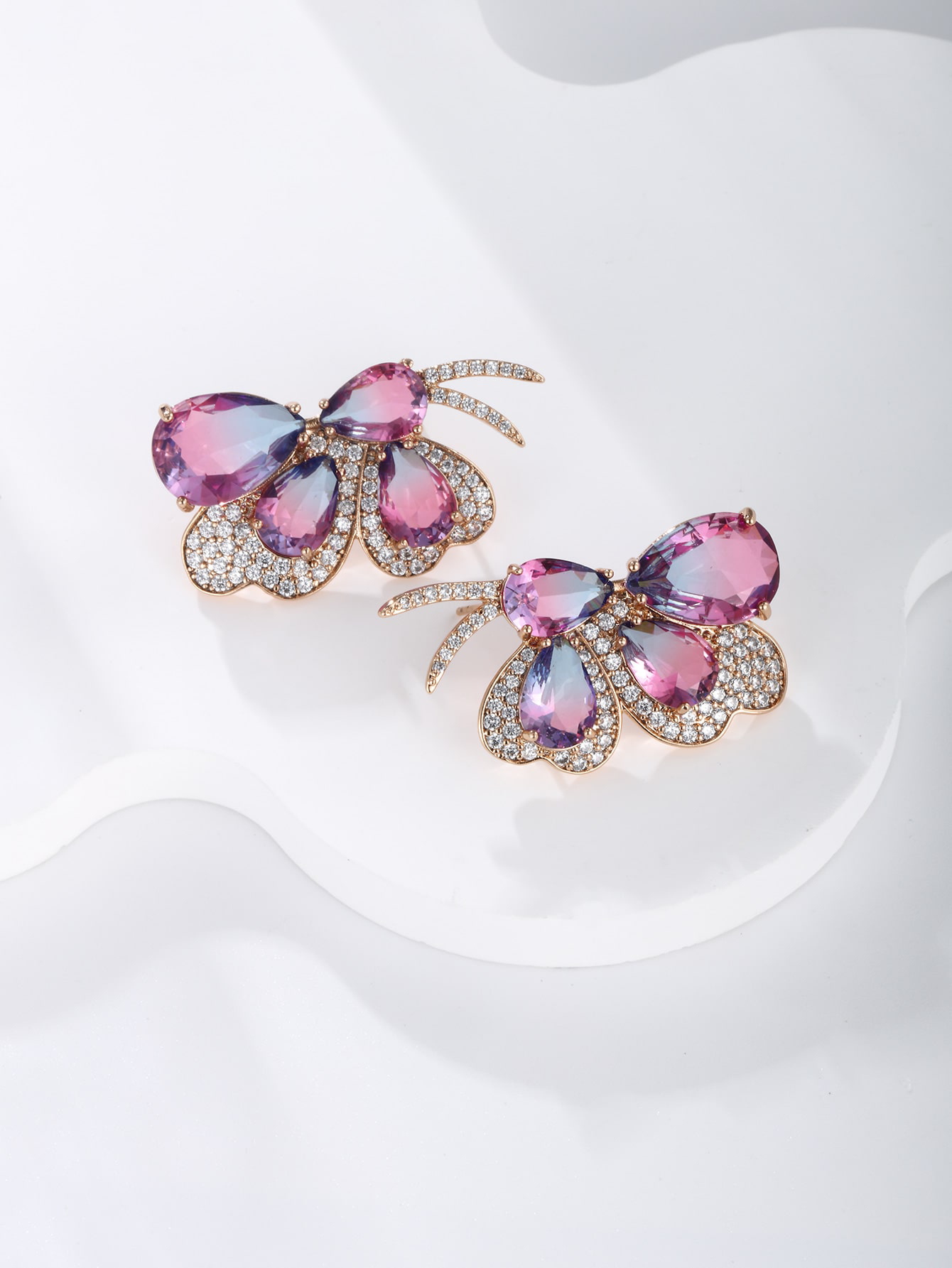 GZ Ice presents A pair of light luxuriously elegant imitation Austrian crystal butterfly earrings.