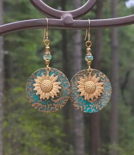 GZ Ice presents elevating your style with our stunning Color Separation Sunflower Earrings, featuring a bohemian-inspired design and intricate detailing that exude timeless elegance and retro charm. Perfect for any occasion.